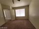 Bedroom with an ensuite bathroom featuring a large window and closet space at 3012 Silver Canyon Ln, North Las Vegas, NV 89031