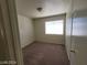 Bedroom with neutral walls, carpet, and a bright window at 3012 Silver Canyon Ln, North Las Vegas, NV 89031