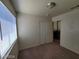 Bedroom with neutral walls, bright window, and a ceiling fan at 3012 Silver Canyon Ln, North Las Vegas, NV 89031