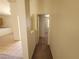 A hallway with carpet flooring connects the rooms of the home at 3012 Silver Canyon Ln, North Las Vegas, NV 89031