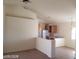 Spacious living area flowing into the dining area and a view into the kitchen at 3012 Silver Canyon Ln, North Las Vegas, NV 89031