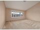 Bedroom with large windows offering great natural light, neutral paint, and carpet at 3032 Bonnie Rock Dr, Las Vegas, NV 89134