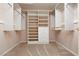 Spacious walk-in closet with custom shelving and drawers for optimal storage at 3032 Bonnie Rock Dr, Las Vegas, NV 89134