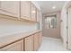 Hallway featuring built-in cabinets with tile flooring and neutral wall colors at 3032 Bonnie Rock Dr, Las Vegas, NV 89134