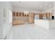 Open concept kitchen with custom cabinetry, a chandelier, and stainless appliances at 3032 Bonnie Rock Dr, Las Vegas, NV 89134