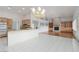Open concept living space with a kitchen island and fireplace at 3032 Bonnie Rock Dr, Las Vegas, NV 89134