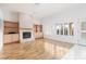 Bright and airy living room with fireplace, built-in shelving, and wood-look flooring at 3032 Bonnie Rock Dr, Las Vegas, NV 89134