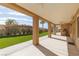 Bright and airy covered patio with ceiling fans and easy access to artificial lawn and backyard at 3032 Bonnie Rock Dr, Las Vegas, NV 89134