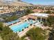 Aerial view of community pool, spa, and lounging area with mountain view in background at 3032 Bonnie Rock Dr, Las Vegas, NV 89134