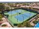 Aerial shot of well-maintained community tennis courts with desert landscape background at 3032 Bonnie Rock Dr, Las Vegas, NV 89134