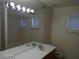 Bathroom with double sinks, large mirror, and shower at 3401 Conan St # 103, Las Vegas, NV 89129