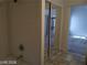 Tiled shower with a mirrored closet and bedroom view at 3401 Conan St # 103, Las Vegas, NV 89129