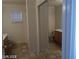 Bathroom showcasing double sinks and tub/shower with tiled walls at 3401 Conan St # 103, Las Vegas, NV 89129