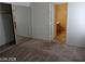 Bedroom with mirrored closet doors and view to bathroom at 3401 Conan St # 103, Las Vegas, NV 89129