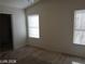 Bedroom showcasing two windows, neutral carpet, and bright, airy feel at 3401 Conan St # 103, Las Vegas, NV 89129