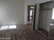 Bedroom featuring a mirrored closet and tan carpet at 3401 Conan St # 103, Las Vegas, NV 89129