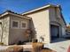 Home with an attached two-car garage and well-maintained desert landscaping at 3401 Conan St # 103, Las Vegas, NV 89129