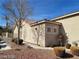 Charming home featuring stucco walls, a tile roof, and well-maintained landscaping at 3401 Conan St # 103, Las Vegas, NV 89129