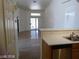 Open floor plan with tiled floor and a sliding glass door bringing in natural light at 3401 Conan St # 103, Las Vegas, NV 89129