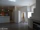 Open-concept living area with tile flooring and a fireplace at 3401 Conan St # 103, Las Vegas, NV 89129