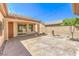 A back patio featuring stucco walls, desert landscaping, and a covered patio at 35 Glade Water Dr, Henderson, NV 89052
