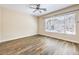 This bright bedroom with beautiful wood-look tile features a large window with natural light at 35 Glade Water Dr, Henderson, NV 89052