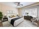 Staged bedroom showcasing a plush bed, stylish decor, and ample natural light at 35 Glade Water Dr, Henderson, NV 89052
