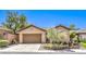 Charming single-story home featuring a well-maintained front yard and a two-car garage at 35 Glade Water Dr, Henderson, NV 89052