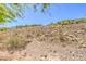 The arid hillside behind the homes adds natural beauty to the neighborhood at 35 Glade Water Dr, Henderson, NV 89052