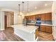 Modern kitchen with large center island, stainless steel appliances, and custom cabinetry at 35 Glade Water Dr, Henderson, NV 89052