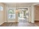 Bright living space with wood flooring and large sliding doors opening to the outdoor patio at 35 Glade Water Dr, Henderson, NV 89052