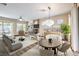 Bright living room features modern furniture, fireplace, and natural light from large windows at 35 Glade Water Dr, Henderson, NV 89052