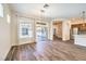 Open living space with wood floors, natural light, and sliding glass doors to the outside patio at 35 Glade Water Dr, Henderson, NV 89052