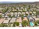View of a suburban neighborhood featuring solar panels and landscaped yards at 35 Glade Water Dr, Henderson, NV 89052