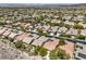 A sprawling residential area featuring diverse homes and lush green trees at 35 Glade Water Dr, Henderson, NV 89052