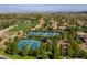 Overhead shot of the community tennis and basketball courts nestled amongst green trees at 35 Glade Water Dr, Henderson, NV 89052
