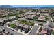 Bustling neighborhood featuring many homes and green spaces stretching towards the horizon under a clear blue sky at 351 Nativo Ave, North Las Vegas, NV 89031