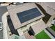 Aerial view of house roof with solar panels and backyard with lawn and gravel at 351 Nativo Ave, North Las Vegas, NV 89031