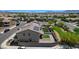Well-maintained backyard featuring a patio, manicured lawn, and privacy fence at 351 Nativo Ave, North Las Vegas, NV 89031