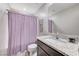 Modern bathroom featuring granite countertop, a shower with curtain, and contemporary fixtures at 351 Nativo Ave, North Las Vegas, NV 89031
