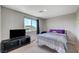 Bedroom with large window, providing abundant natural light, and cozy furnishings for comfortable living at 351 Nativo Ave, North Las Vegas, NV 89031