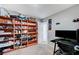 Inviting bedroom featuring ample shelving for storage and display, complemented by a functional desk setup at 351 Nativo Ave, North Las Vegas, NV 89031