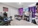 Eclectic bedroom featuring a desk, gaming system, decorations, and a closet, perfect for hobbies at 351 Nativo Ave, North Las Vegas, NV 89031