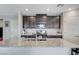 Well-equipped kitchen showcasing granite countertops, stainless steel appliances, and dark cabinetry at 351 Nativo Ave, North Las Vegas, NV 89031