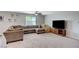 Cozy living room featuring a large sectional sofa, a comfy beanbag, and a modern entertainment center at 351 Nativo Ave, North Las Vegas, NV 89031