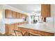 Bright kitchen with a breakfast bar and long countertops with plenty of storage at 3611 W Horn Rd, Pahrump, NV 89048