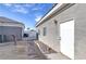 Side view of a backyard featuring a path and a well-maintained exterior at 3684 Mooncrest Cir, Las Vegas, NV 89129