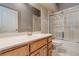 Bathroom with tiled floor, bathtub, shower, vanity, mirror, and updated faucet at 3684 Mooncrest Cir, Las Vegas, NV 89129