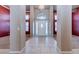 Elegant foyer with tile flooring, a chandelier, and views into the living spaces, showcasing sophistication at 3684 Mooncrest Cir, Las Vegas, NV 89129
