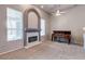 Living room featuring a fireplace, carpet, neutral paint, ceiling fan, a piano, and lots of natural light at 3684 Mooncrest Cir, Las Vegas, NV 89129